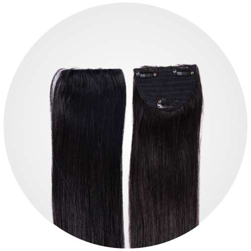 Two hair extension patches with clips attached.