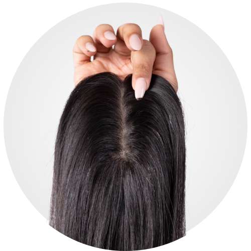 Hand showing a close-up view of a black hair topper