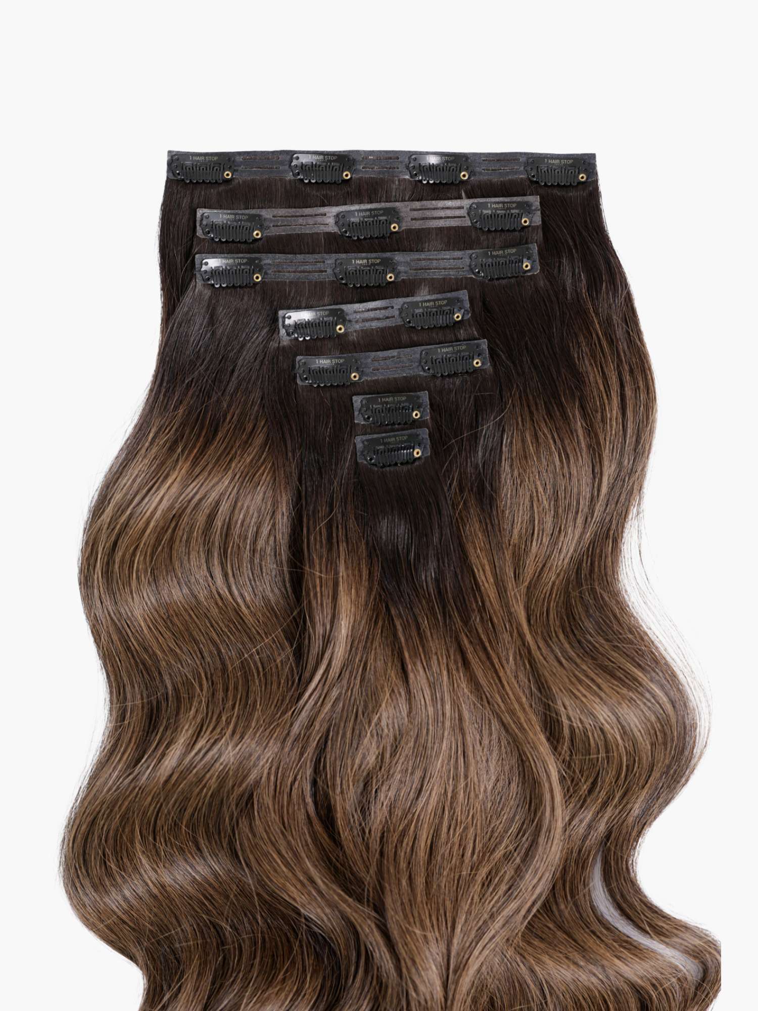 Wavy brown hair extensions with clips.
