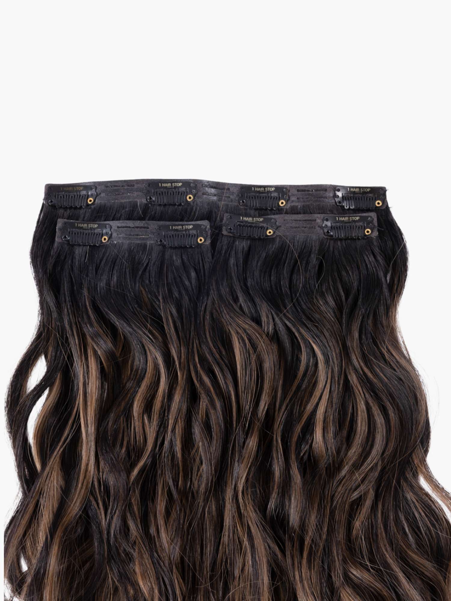 Alt text: Clip-in hair extensions with wavy texture.